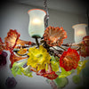 Chandelier 'Kitengela Classic' 80cm dia, 4 red rim light cups, 16 red & yellow flowers